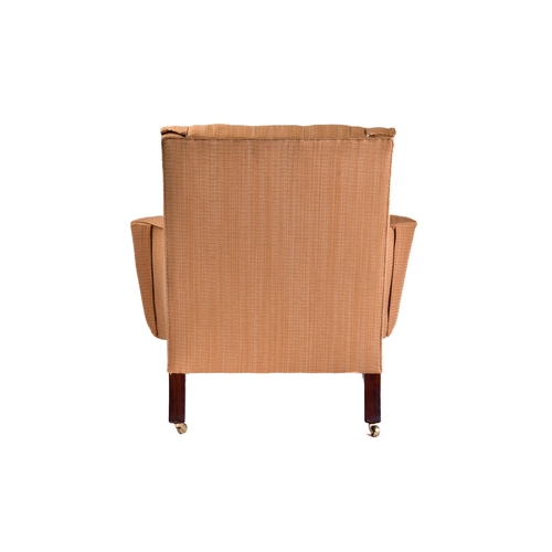 299 - A Howard Ltd upholstered armchair. 21st century, with shaped out swept arms and low, deep buttoned b... 