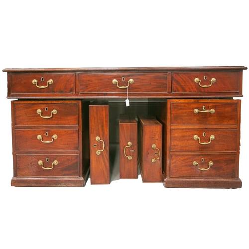 300 - A mahogany kneehole partners desk, George IV, with a cross banded inset tooled leather top. Fitted t... 