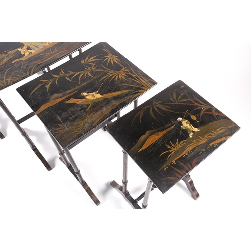 303 - A 19th-century Anglo-Chinese black pappier mache quartetto of inter sliding side tables. The tops de... 