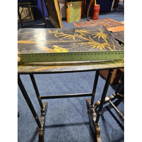 303 - A 19th-century Anglo-Chinese black pappier mache quartetto of inter sliding side tables. The tops de... 