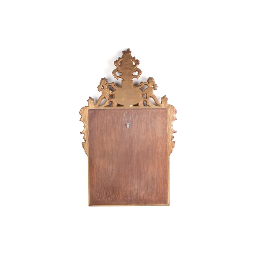 306 - A Florentine style carved and giltwood wall mirror, 20th century with a Neo-Classical frame, set wit... 