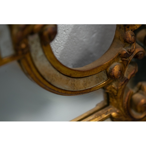 306 - A Florentine style carved and giltwood wall mirror, 20th century with a Neo-Classical frame, set wit... 