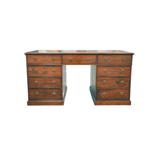 307 - A George IV figured mahogany kneehole partner's desk, with inset tooled tan hide inset and crossband... 