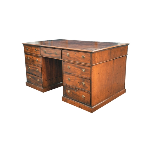 307 - A George IV figured mahogany kneehole partner's desk, with inset tooled tan hide inset and crossband... 