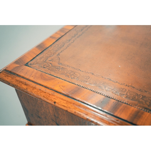 307 - A George IV figured mahogany kneehole partner's desk, with inset tooled tan hide inset and crossband... 