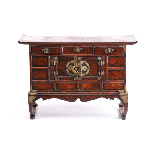 309 - A Chinese elm low cabinet, the first half of the 20th century, with everted top above three frieze d... 