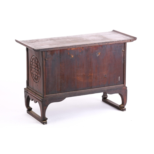 309 - A Chinese elm low cabinet, the first half of the 20th century, with everted top above three frieze d... 