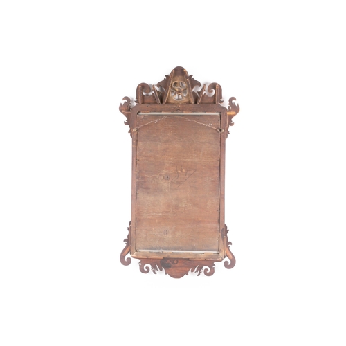 310 - A George III mahogany scroll framed wall mirror, with carved pierced and gilt 