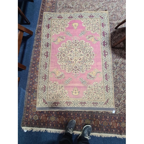 315 - A fine late 19th century /early 20th-century plum red ground silk Isfahan rug, with central barbed m... 