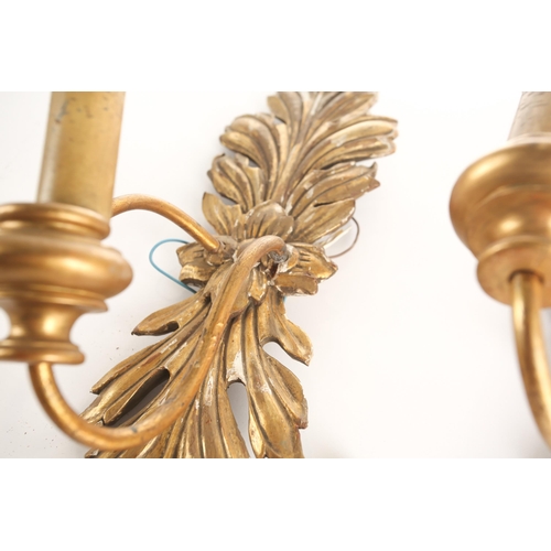 323 - A pair of Louis XVI style gilt brass wall sconces, 20th century, of tied cord form with faux hanging... 