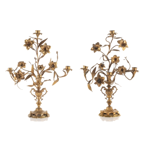 347 - A pair of French ormolu four sconce candelabra,19th century. In the form of trumpet Lillies issued f... 