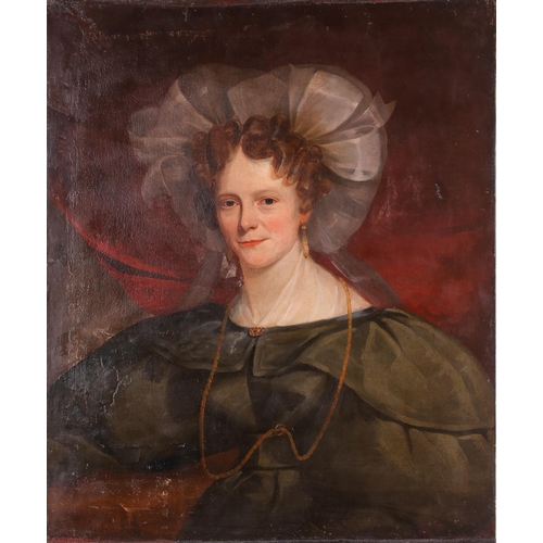 40 - 19th century Continental school, a head and shoulders portrait of a woman, wearing a green dress and... 