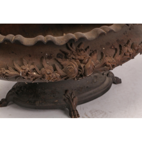 462 - A large pair of French late 19th century cast iron two handle oval jardinieres. With floral decorati... 