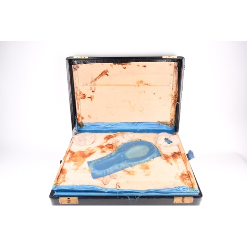 476 - A large late 19th-century leather travel vanity case, the fitted blue silk interior with tortoiseshe... 