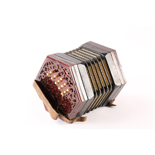 477 - A Lachenal & Co. twenty-seven bone-button concertina, with pierced fretworked rosewood ends, leather... 