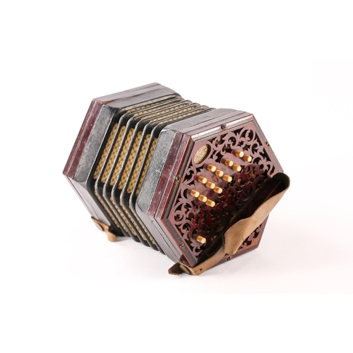 477 - A Lachenal & Co. twenty-seven bone-button concertina, with pierced fretworked rosewood ends, leather... 