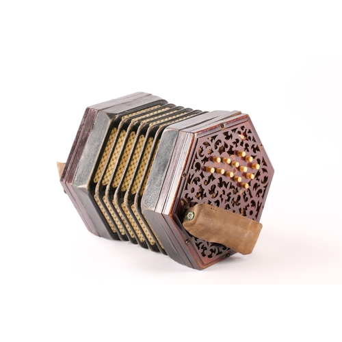 477 - A Lachenal & Co. twenty-seven bone-button concertina, with pierced fretworked rosewood ends, leather... 