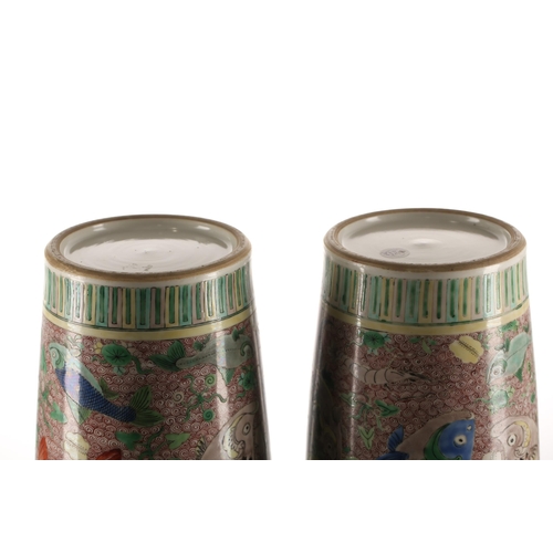 89 - A pair of Chinese famille verte vases, Qing, of cylindrical form, painted with various fish, crabs a... 