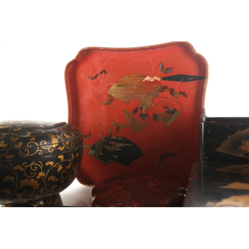 97 - A small collection of Japanese lacquered boxes, and a lacquered tea tray, Meiji and later, stacking ... 