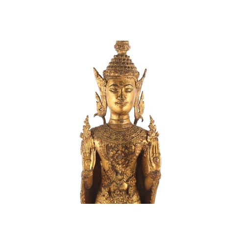 99 - A Thai gilt bronze figure of Buddha, 19th/20th century, standing in double Abhaya Mudra, with inset ... 