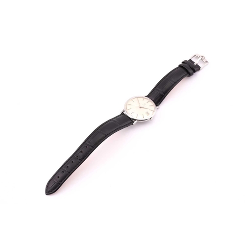 505 - A hand-wound Omega with a steel case measuring 34mm and silver colour dial with a date aperture at 3... 