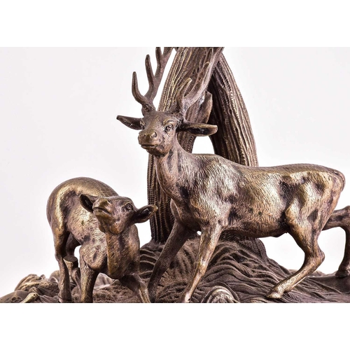540 - A large silver plated table centrepiece, 19th century, modelled as a stag and doe before two large e... 