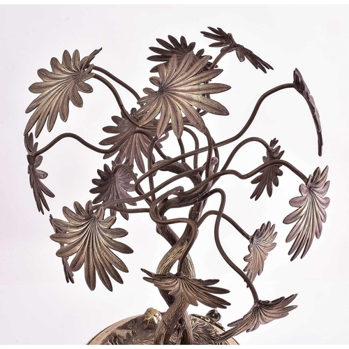 540 - A large silver plated table centrepiece, 19th century, modelled as a stag and doe before two large e... 