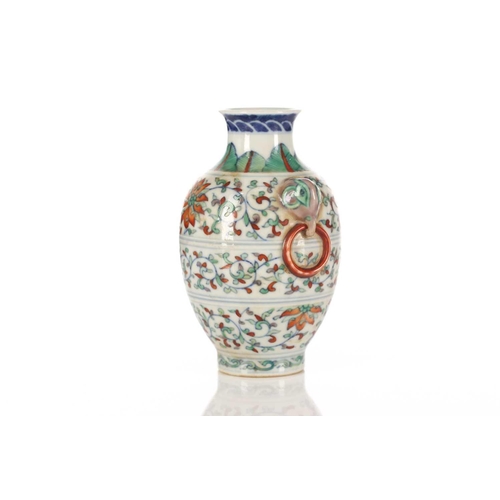 156 - A Chinese porcelain Doucai vase, possibly republic period, the shoulder painted with leaves above li... 