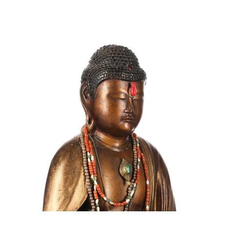 157 - A Nepalese terracotta Buddha plaque, early 20th century, 14.5cm x 19cm; a Tibetan brass prayer wheel... 