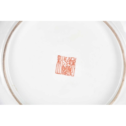 167 - A Chinese famille rose saucer dish, painted with the Tang general Guo Ziyi, with lines of calligraph... 