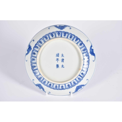 169 - A Chinese blue & white dragon saucer dish, painted with a central writhing dragon with pearl amongst... 