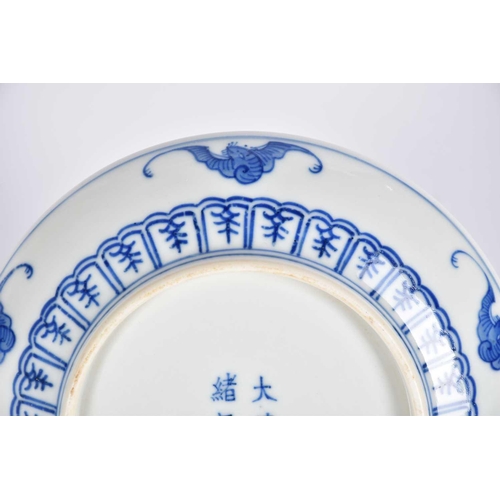 169 - A Chinese blue & white dragon saucer dish, painted with a central writhing dragon with pearl amongst... 