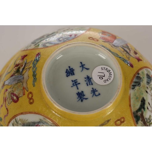 170 - A Chinese yellow ground bowl, 20th century, painted with medallions of goats by blossoming trees wit... 