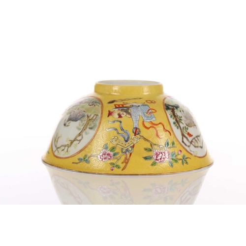 170 - A Chinese yellow ground bowl, 20th century, painted with medallions of goats by blossoming trees wit... 