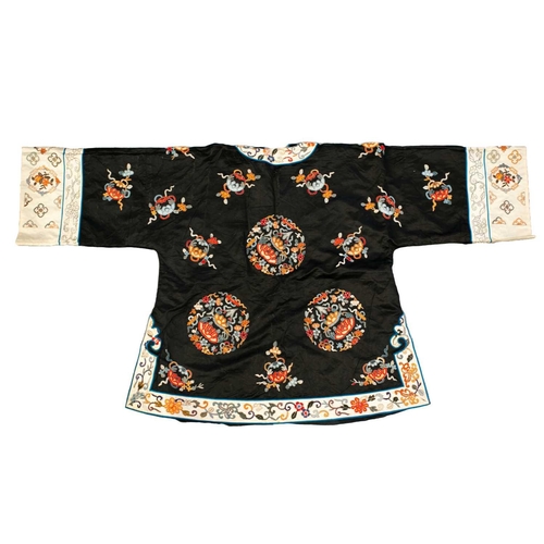 172 - Two Chinese embroidered silk summer jackets, 20th century, one decorated with gourds against a black... 