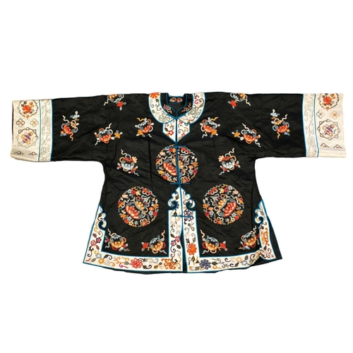 172 - Two Chinese embroidered silk summer jackets, 20th century, one decorated with gourds against a black... 