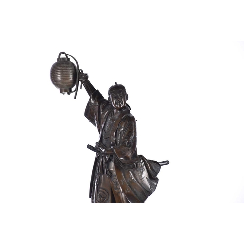 173 - Two Japanese bronze okimono of samurai, Meiji period, signed Akasofu Gyoko, cast as a signalman hold... 