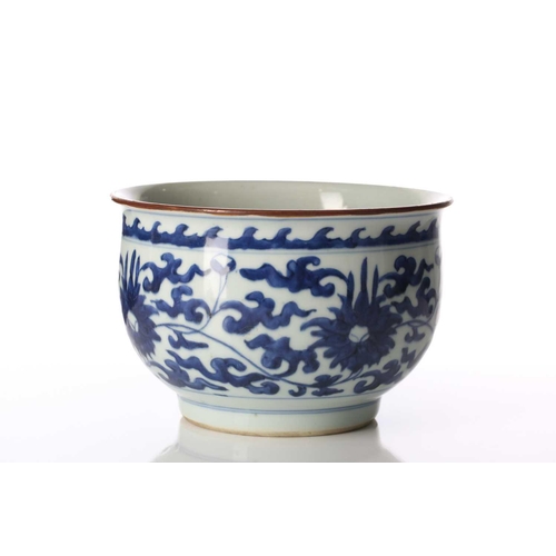 179 - A Chinese blue & white deep sided bowl, in the Ming style, with lotus flower decoration beneath a ba... 