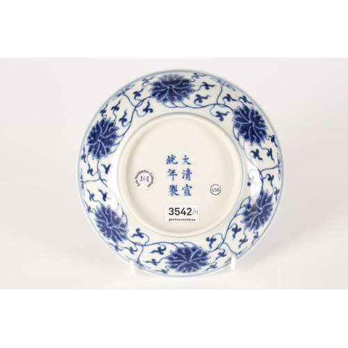 181 - A Chinese porcelain blue & white dish, painted with lotus flowers and tendrils within a similar bord... 