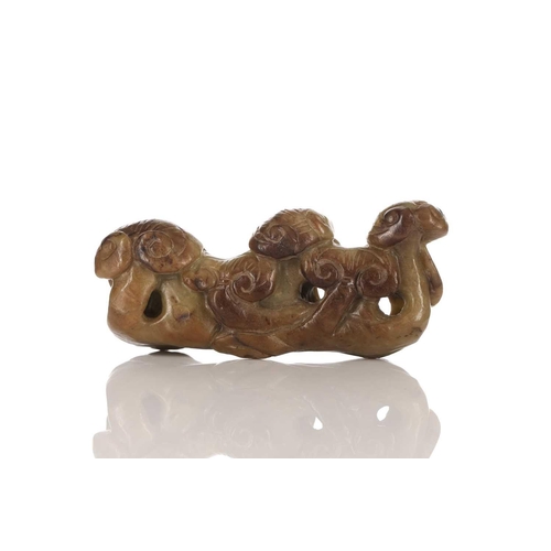 183 - A Chinese jade brush rest, 20th century, carved as a group of lingzhi, the stone a pale green and br... 