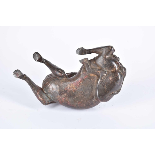 185 - A Chinese bronze censer, modelled as a Pixiu in recumbent pose, its snarling head looking over its s... 