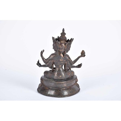 191 - A Chinese bronze figure of the Tibetan deity Usnisavijaya, seated o a double lotus base, traces of r... 