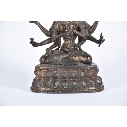 191 - A Chinese bronze figure of the Tibetan deity Usnisavijaya, seated o a double lotus base, traces of r... 