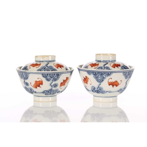 196 - A pair of Chinese porcelain Wufu ( five fortunes) bowls and covers, each piece painted with five red... 