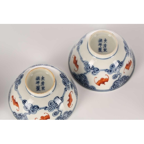 196 - A pair of Chinese porcelain Wufu ( five fortunes) bowls and covers, each piece painted with five red... 