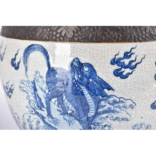 197 - A Chinese crackle glaze blue & white jardiniere, Qing, late 19th century, finely painted with shallo... 