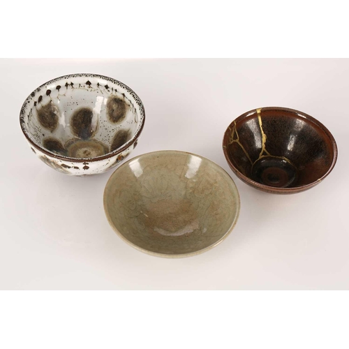 206 - A Chinese Jian ware hares fur bowl, Song or later, with kintsugi repairs11.5cm dia; a small Longquan... 