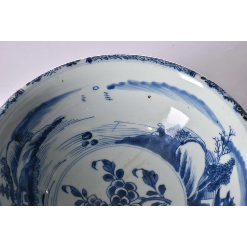 207 - A Chinese blue & white bowl, Shunzhi, mid 17th century, the interior painted with a foliate sprig bo... 