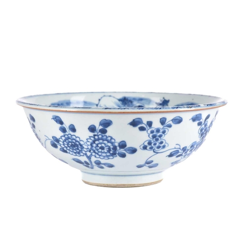 207 - A Chinese blue & white bowl, Shunzhi, mid 17th century, the interior painted with a foliate sprig bo... 