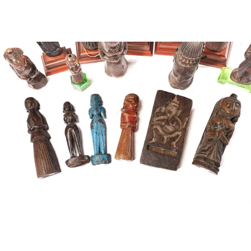 209 - A collection of Indian carved wood figures, 18/19th century and later, mostly depicting standing fem... 